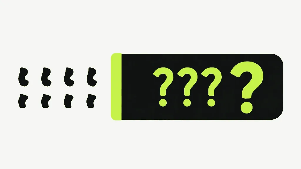 A few small dark marks beside a dark panel showing bright question marks