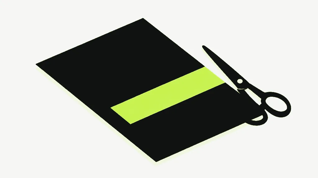 A large near-black sheet lying flat at an angle on a pale background, a bright lime band running across it, and a pair of dark scissors resting at its right edge